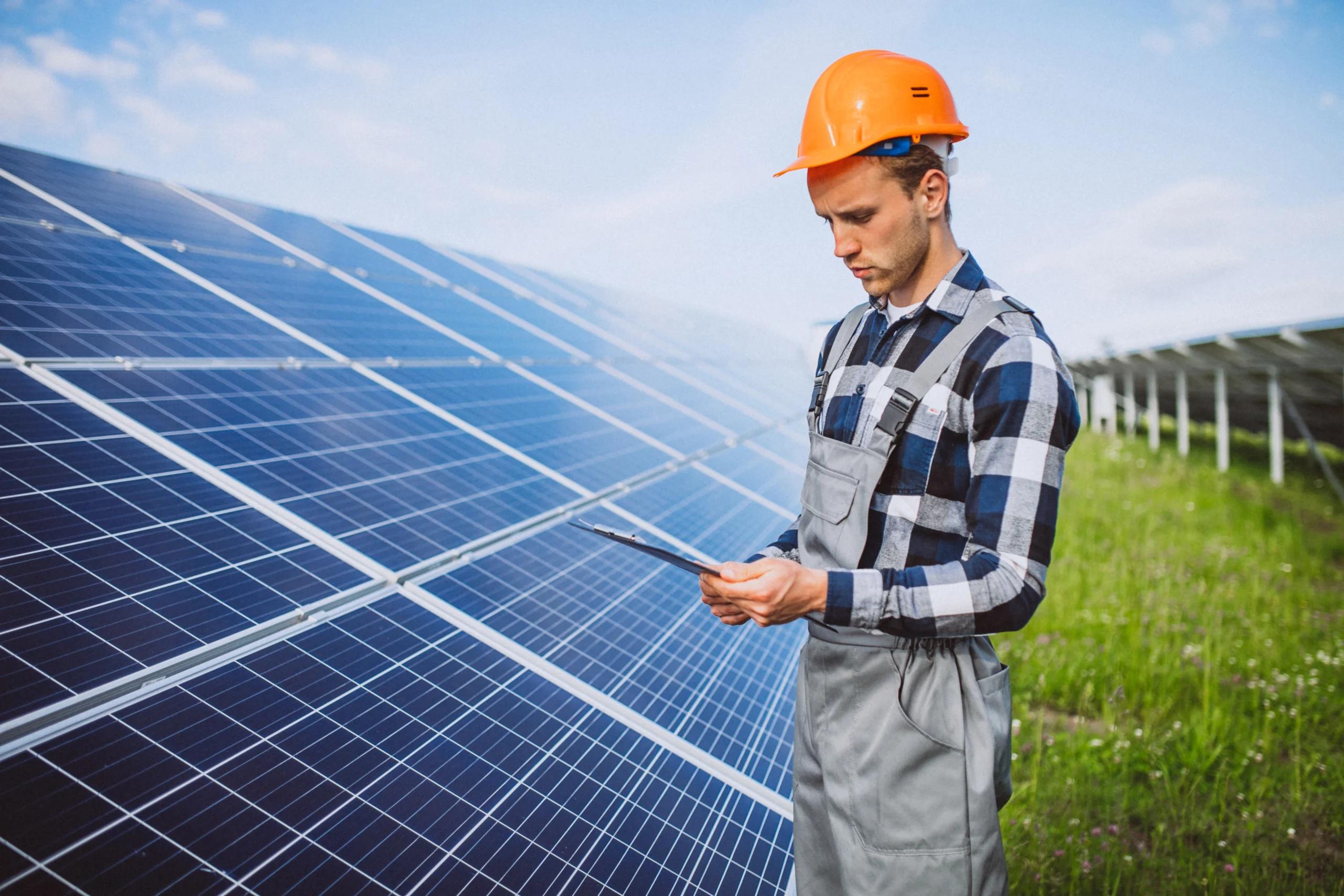 man worker firld by solar panels